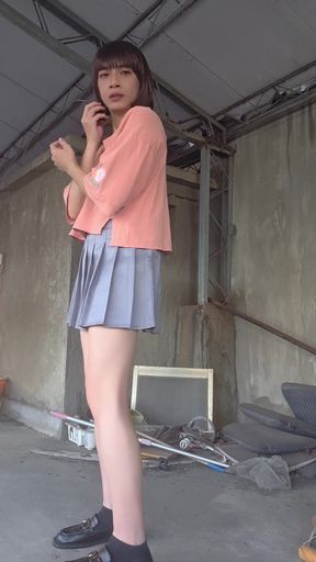 A Pleated Skirt Paired with White Underwear, and an Anal Plug Inserted on the Terrace