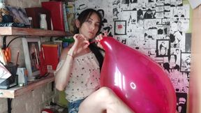 I gently play with the red balloon using my mouth - Mishel Looner Balloons