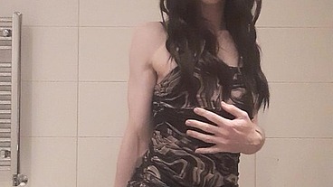 Sexy femboy in tights and dress playing with dildo