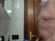 Horny daddy shaves his beard and pubes, then cums with his big cock.