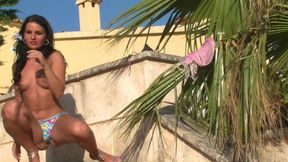 Sexy brunette shows off her perfect body outdoor