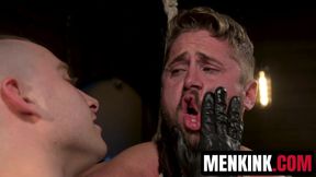 Wesley Woods howls as Sebastian Keys pours hot wax on his bound body