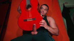 Masturbation of large penis on carrot colored background - GuitarJob - Guitar Masturbation