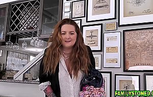 Stepdaughter joins stepdad on the couch to have a taste of his cock