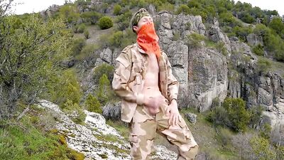 Soldier wanks himself on the mountainside on a warm spring day in the northern Rocky Mountains.