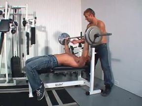 Threesome with bisexual male duo and sexy blonde in gym with strapon action