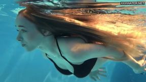 Blonde teen shows off perfect body during nude swim