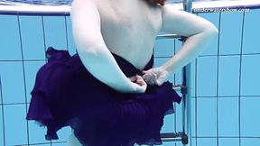 Czech teen Lenka shows off her hot round ass underwater