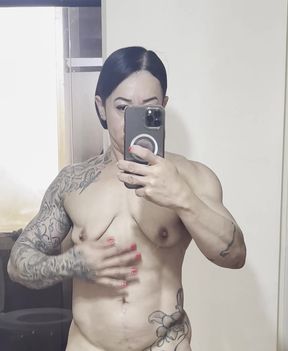 Busty muscular MILF stands tall in a stunning display of confidence