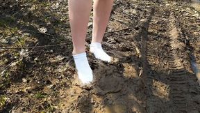 Dirty white socks outdoor wet and muddy, socks in mud, messy socks, dirty socks