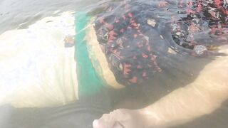 Entirely dressed swim in lake and sagging cutoffs