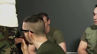 Cock-hungry lad is giving blowjobs to a bunch of soldiers