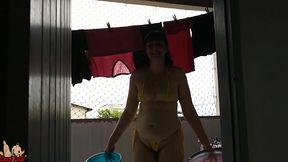 my wife wearing micro bikini on balcony for a worker see