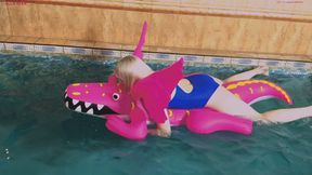 Alla hotly rubs herself on a bright rare inflatable crocodile in the pool and gets pleasure
