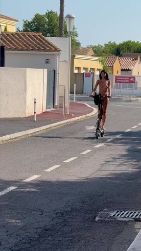 Person riding a scooter on the street