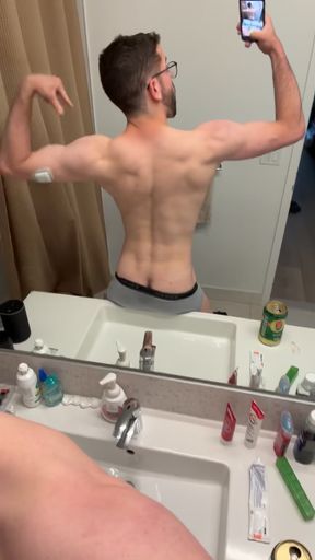 Bisexual jock flexes his muscles