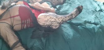 I'm wearing a red bodysuit, black stockings and a sexy robe.