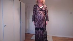 Blonde in black see-through gown and stockings