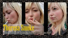 Theresa Smoke calmly smokes a cigarette outdoors while wearing a black nickelson jacket in a relaxed close-up