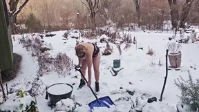 Busty milf shovels snow with big tits and juicy ass on display