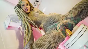 Tattooed beauty digits and pees rough in fishnet stockings