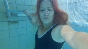 Underwater bubbles, swimming and talking in huge pool