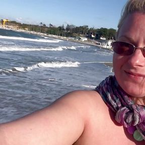 Walking, running and pissingtopless on the public beach