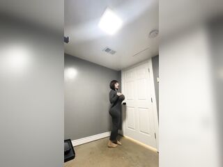 Sexy trans CD in constricted gray costume teasing massive schlong