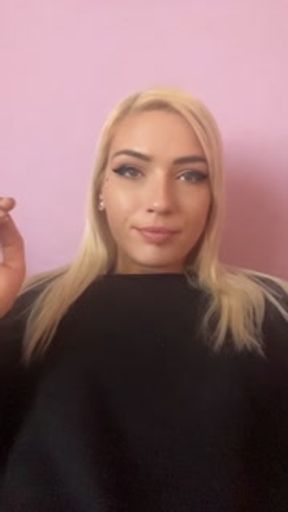 Sexy blonde girl smoke a cigarette