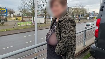 A busty milf braless with sheer top.