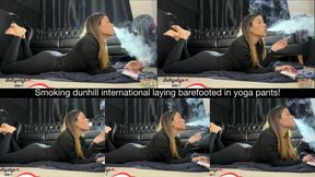 Smoking dunhill international laying barefooted in yoga pants!