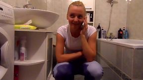 she s talking on the cellphone and peeing in her pants