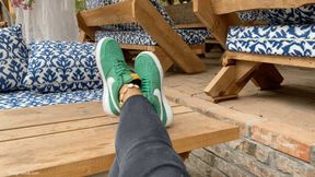 KIRA TAKES OFF HER TIGHT SNEAKERS IN A CAFE - MP4 Mobile Version