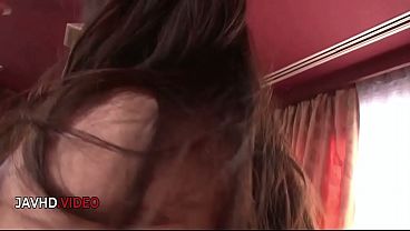 Asian MILF Yuwa Tokona smiles as she feels her wet pussy trickle down her