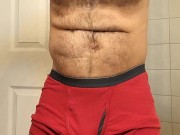 HAIRY MUSCLE BEAR FLEXING IN RED BOXER BRIEFS
