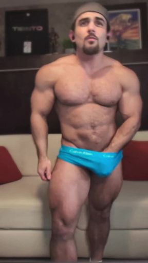 Key moment from "Straight Bodybuilder Flexes Massive Muscles in Private"