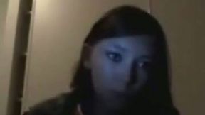 Teen flashes her tits in a dark room on web cam to her BF