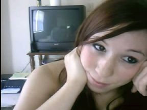 Redhead cutie is bored in the guest room and flashes privates on webcam