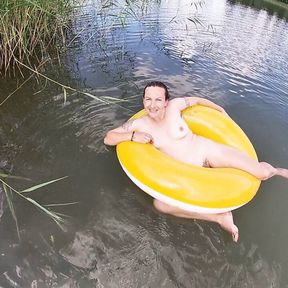 Playing with a Water Donut Naked in the Lake