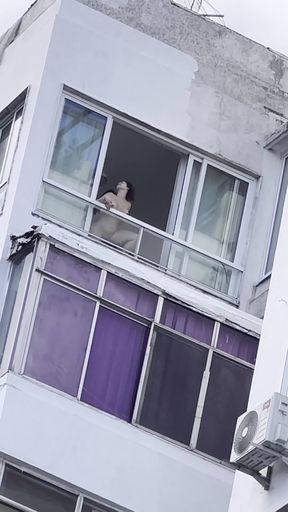 Person looking out window