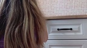 German housewife cleaning the kitchen