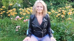 A Mature Woman Is Wearing Sheer Tights Outside.