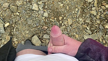 I jerk off a flaccid dick and cum on a mountain lake in nature! POV!