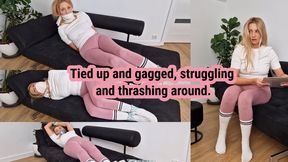 Thief girl caught searching apartment. Tied up and gagged. Struggling and thrashing around.