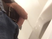 Pissing in urinal