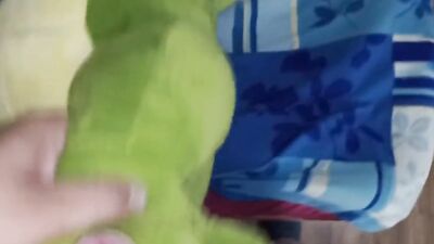 Perverted gay chap is rubbing his willy on a green dinosaur