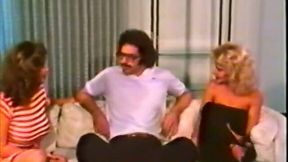 Two classic white chicks on the sofa sharing one dick