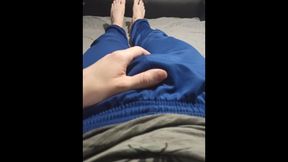 A fellow in blue sweatpants massages his swelling