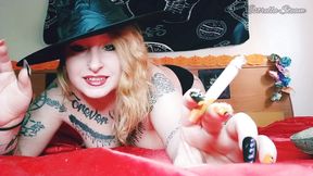 Witch smokes while playing with the smoke