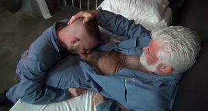 Older man with grey beard is having sex with a prisoner